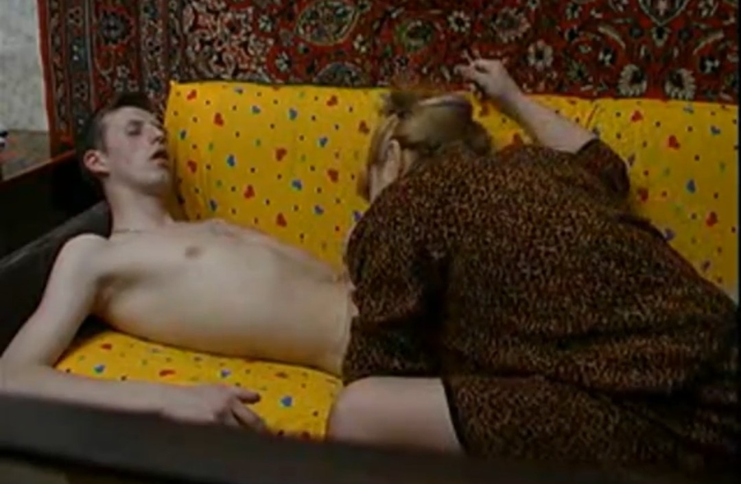 Russian real mom and her son fuck on the couch and film themselves